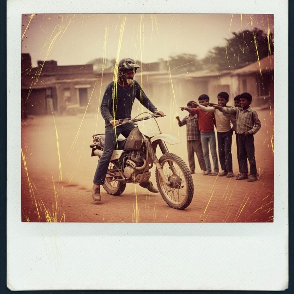 Man wobbling on a dirt bike in an Indian village.