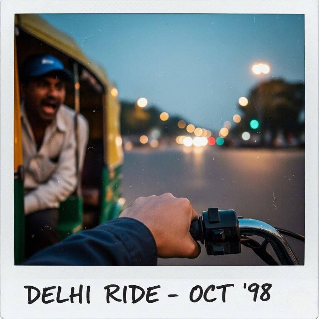 Shaky hand on bike throttle, Delhi intersection.