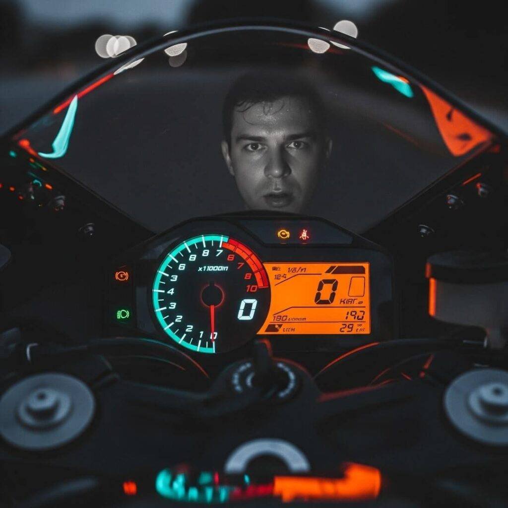  Nervous rider reflection in sport bike dashboard.