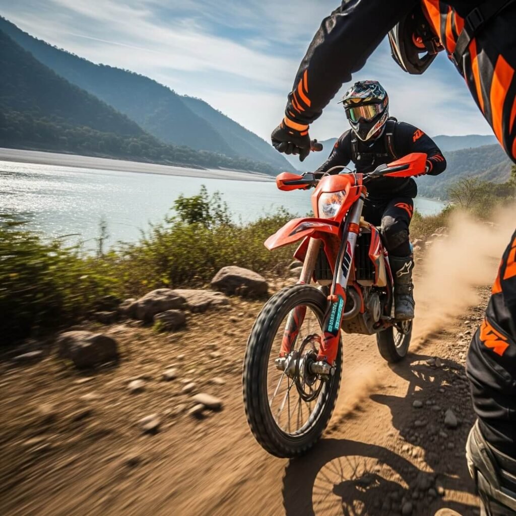 Dirt biker on a dusty trail near river.

